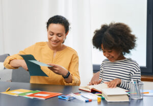 A professional child psychologist working with a smiling child