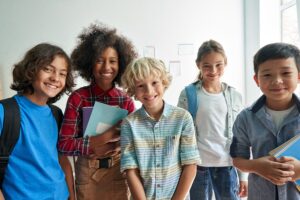 a group of smiling kids looking at the camera